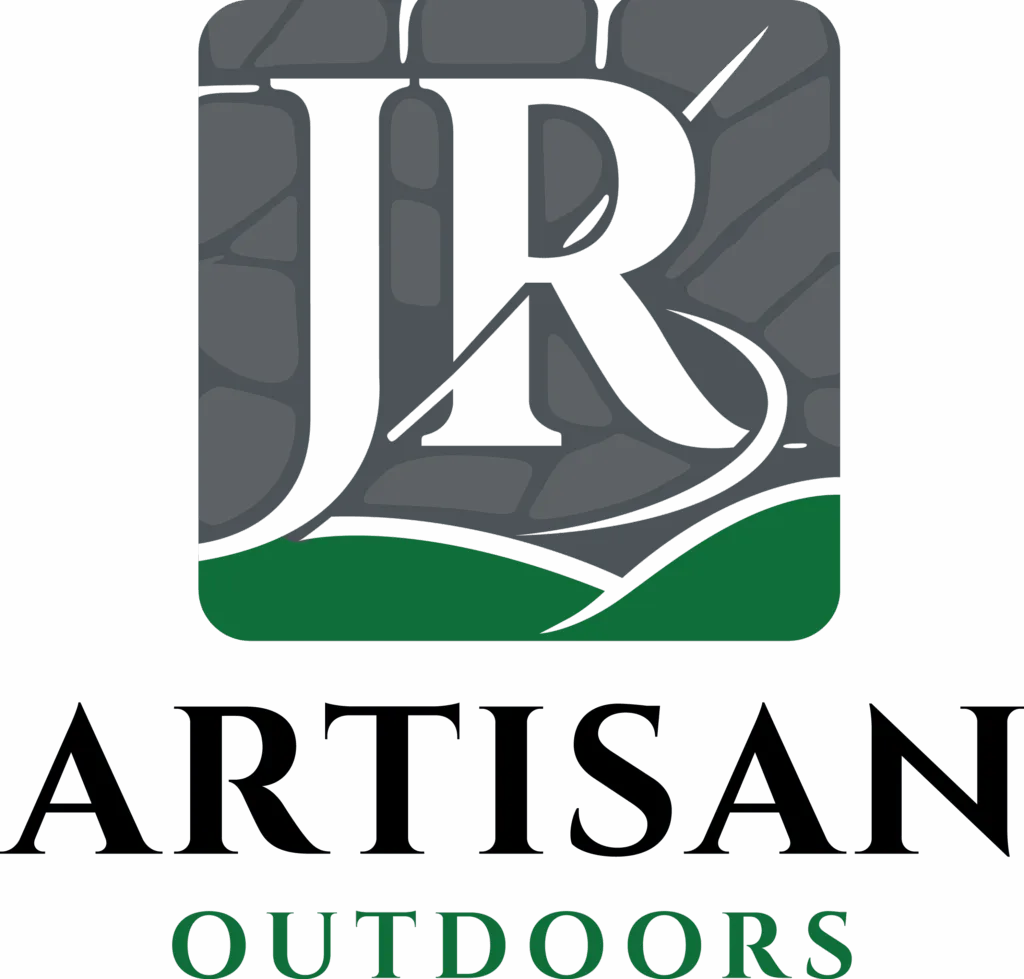 Logo for "JR Artisan Outdoors" featuring large initials "JR" over a gray stone pattern and green curve, with the words "ARTISAN" in black and "OUTDOORS" in green below.